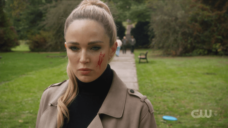 Assassin Sara looks coldly forward, unaffected by the splash of blood on her cheek