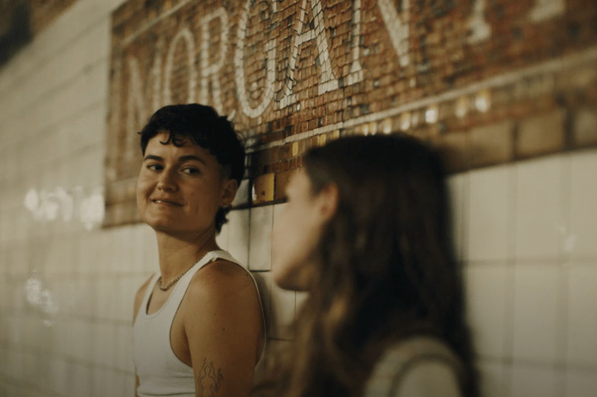 trans boy and a girl waiting for the subway