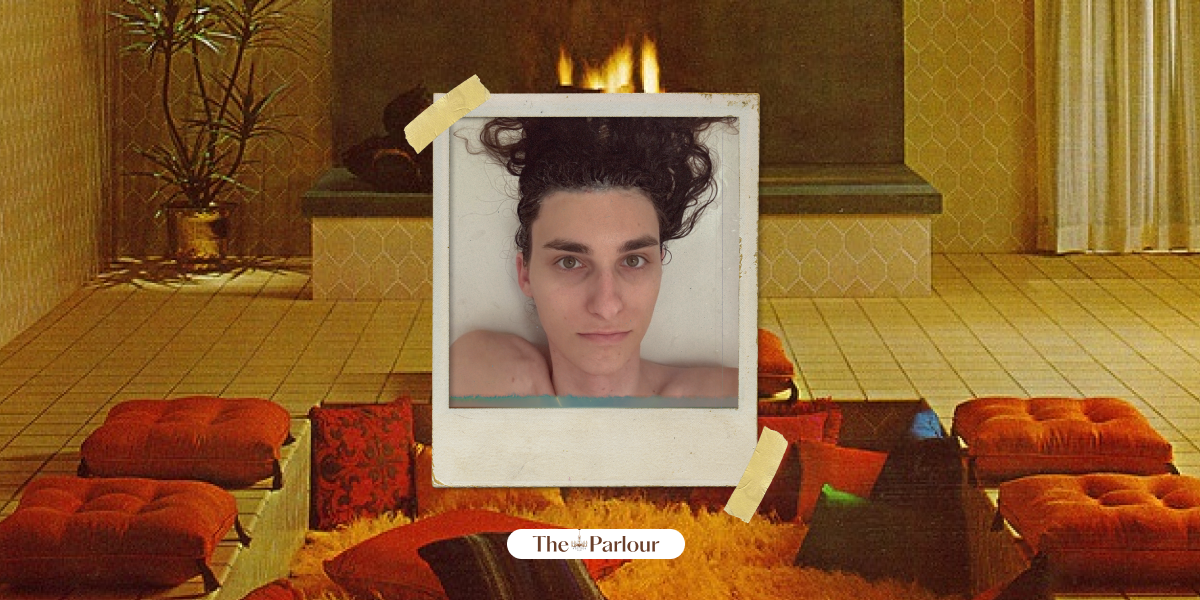 Drew amid a lounging seating area and fireplace