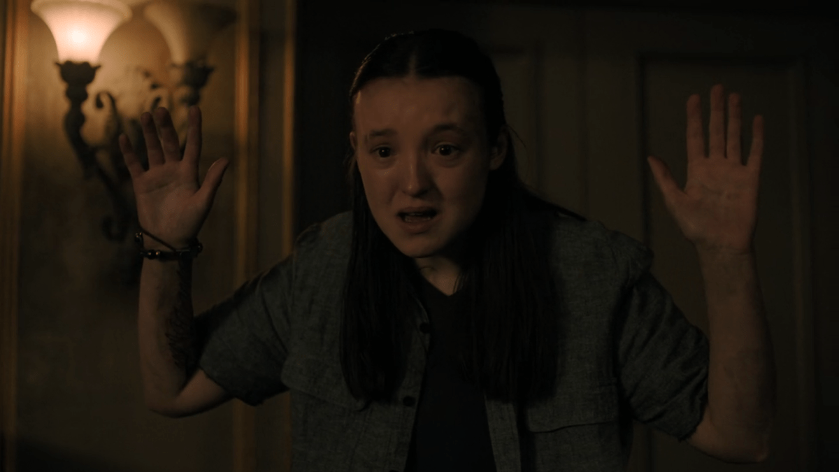 The Last of Us 207 ellie holds her hands up to abby